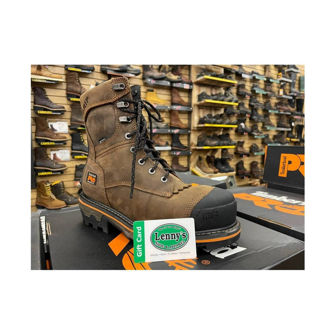Brown waterproof work boot with black toe cap, orange sole stripe, and black laces