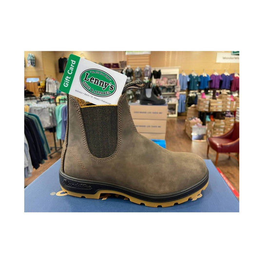 Brown Chelsea work boot with black elastic side gore and tan lug sole, shown on a store display