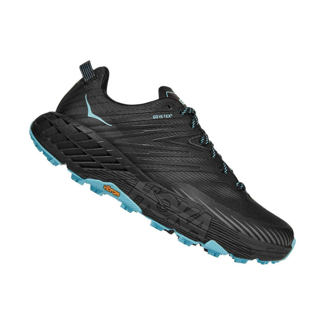 Black low-cut trail running shoe with turquoise outsole, bungee laces, and GORE-TEX marking
