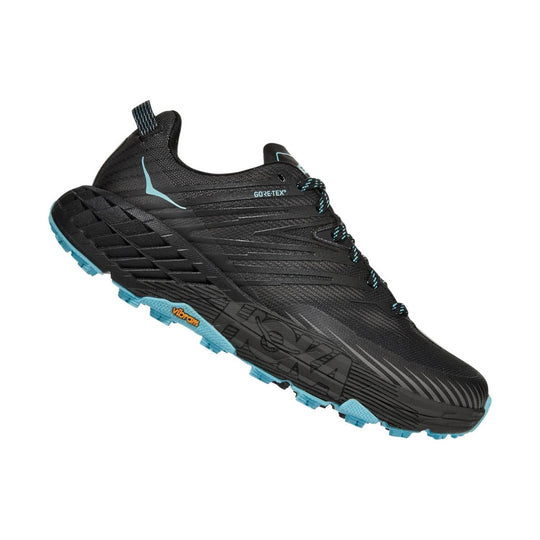 Black low-cut trail running shoe with turquoise outsole, bungee laces, and GORE-TEX marking