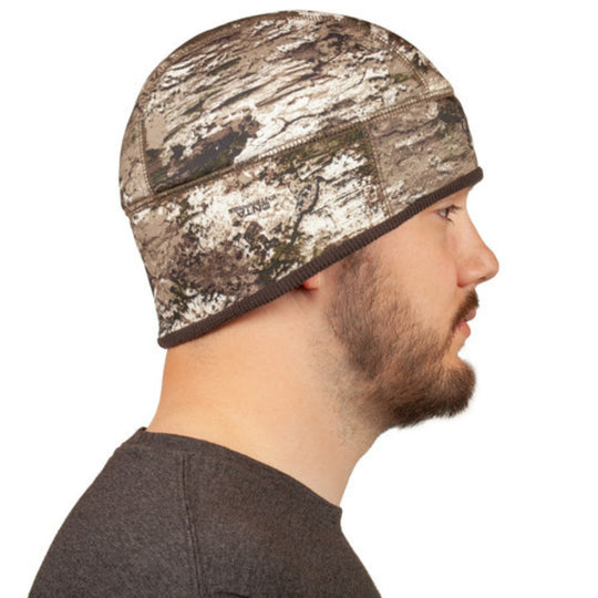Camo fleece beanie with brown trim, shown in side profile on a man