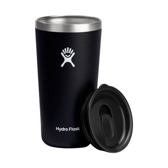 Black insulated tumbler with stainless steel rim and a separate black lid beside it.