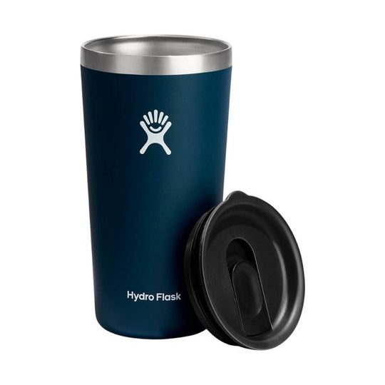 Navy insulated tumbler with a silver rim, black lid, and Hydro Flask logo, shown with the lid off