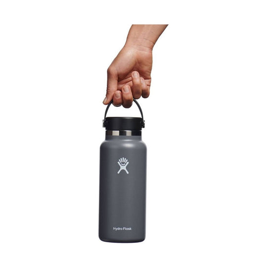 Matte dark gray insulated water bottle with black screw-on cap and carry handle, labeled Hydro Flask