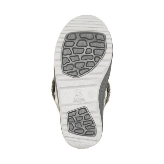 White winter boot sole with dark gray traction pads and embossed logo