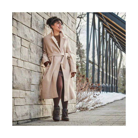 Dark lace-up winter boots with a brown sole
