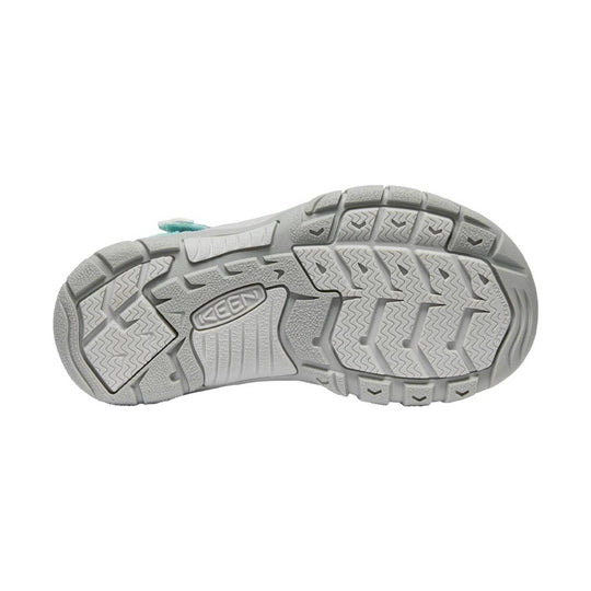 Gray outsole of a KEEN hiking sandal with deep tread and raised toe and heel lugs