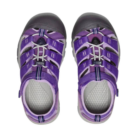 Pair of purple kids' closed-toe sandals with gray toe caps, bungee laces, and black soles, viewed from above