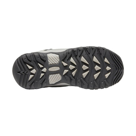 Black hiking shoe outsole with white traction inserts and KEEN logo