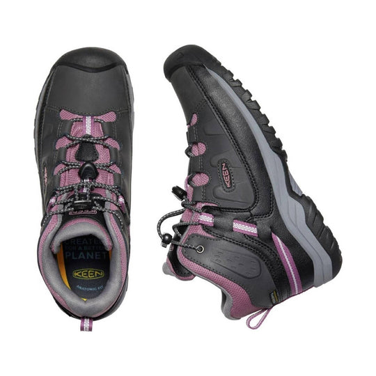 Black and pink hiking boots with bungee laces, side logo patch, and gray midsoles, shown top and side views
