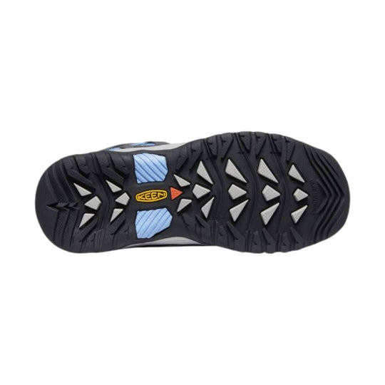 Black rugged hiking shoe outsole with triangular tread and blue midfoot inserts