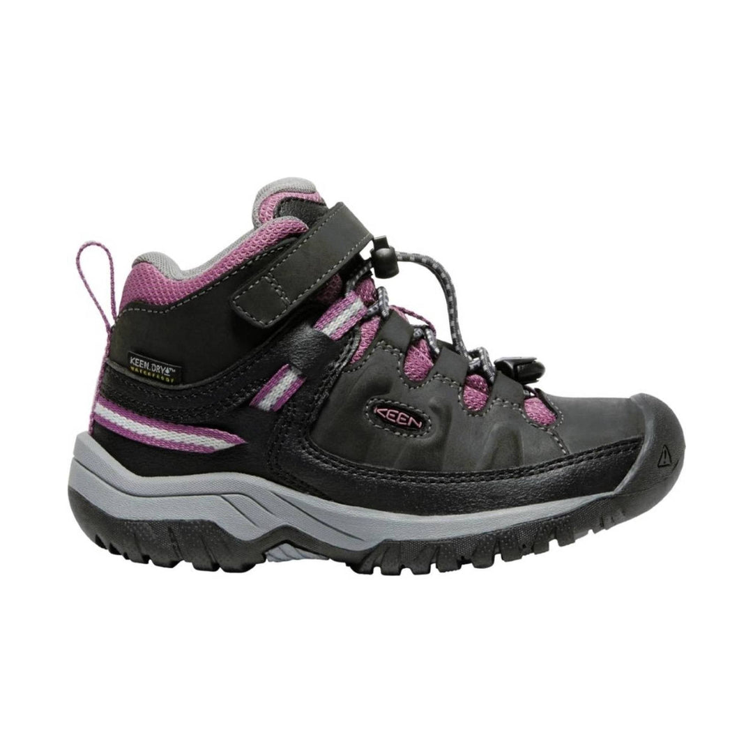 Black and purple children’s hiking boot with bungee laces, ankle strap, and rugged tread, side view