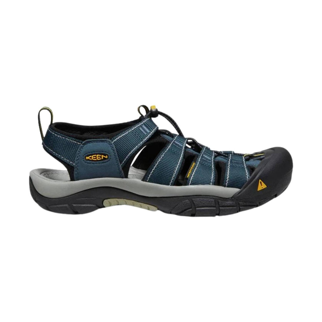 Blue-and-black closed-toe hiking sandal with bungee laces, side straps, and a gray midsole