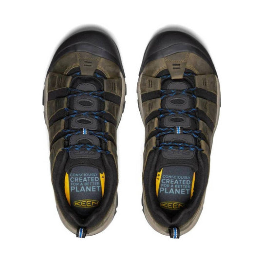 Pair of olive and black hiking shoes with bungee laces and closed toe caps, shown from above