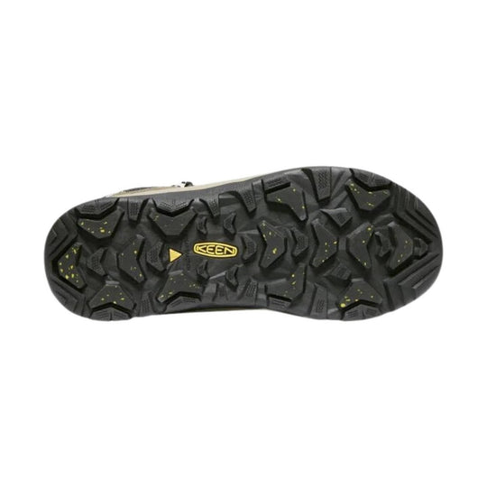 Black boot outsole with rugged tread and yellow KEEN logo