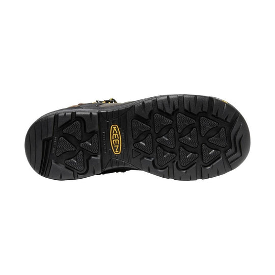 Black work boot outsole with deep tread and a KEEN logo at center