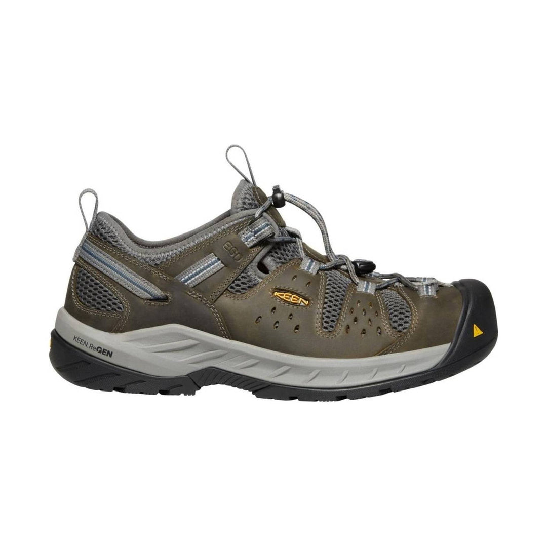 Brown and gray low hiking shoe with bungee laces, mesh panels, and a black reinforced toe cap