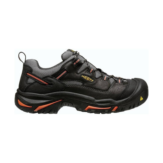 Black low-top work shoe with gray mesh panels, orange accents, and a thick treaded sole