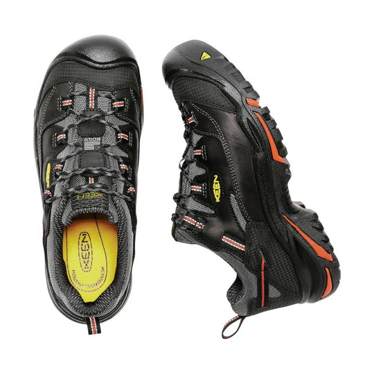 Black low-top work shoe with yellow insole, bungee laces, and orange outsole accents