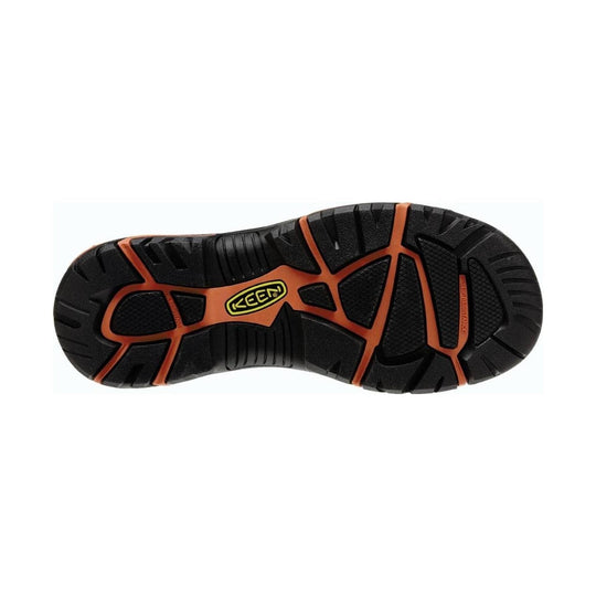 Black work shoe outsole with orange traction channels and KEEN logo