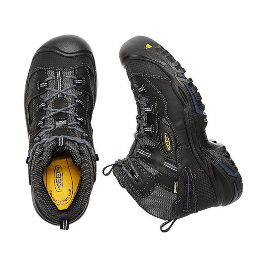 Black mid-top hiking boots with gray mesh panels, blue laces, and yellow KEEN insoles