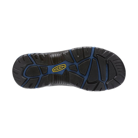 Black hiking boot outsole with blue traction accents and yellow KEEN logo