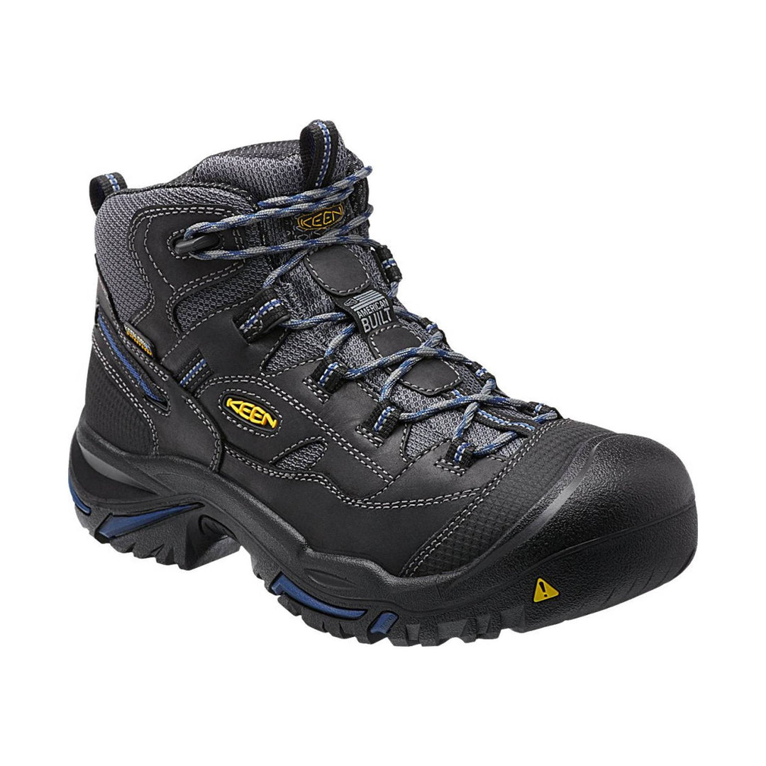 Black and gray mid-cut work boot with blue laces, reinforced toe, and rugged tread