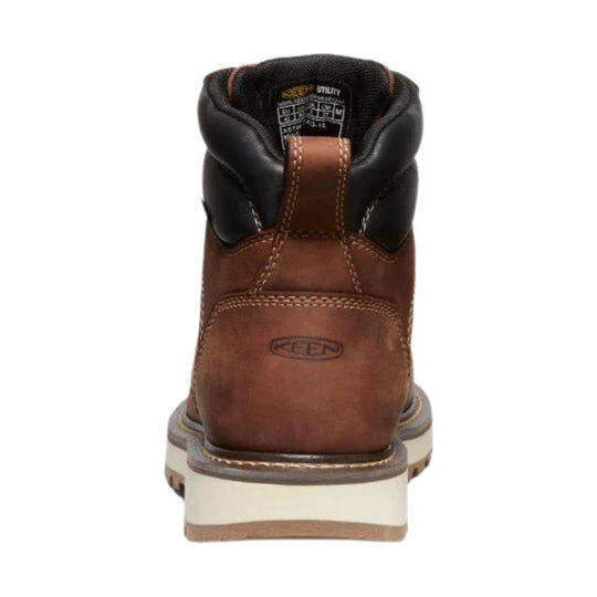 Brown leather work boot seen from the back with black padded collar and cream lug sole
