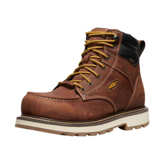 Brown leather lace-up work boot with a black padded ankle collar and thick white sole