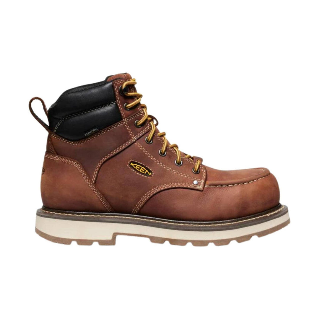 Brown leather work boot with black padded collar, yellow laces, and rugged white outsole