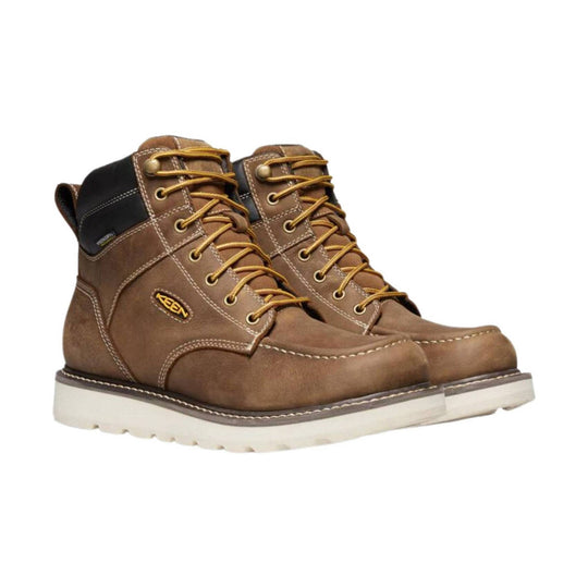Brown lace-up work boots with white midsoles and black padded collars