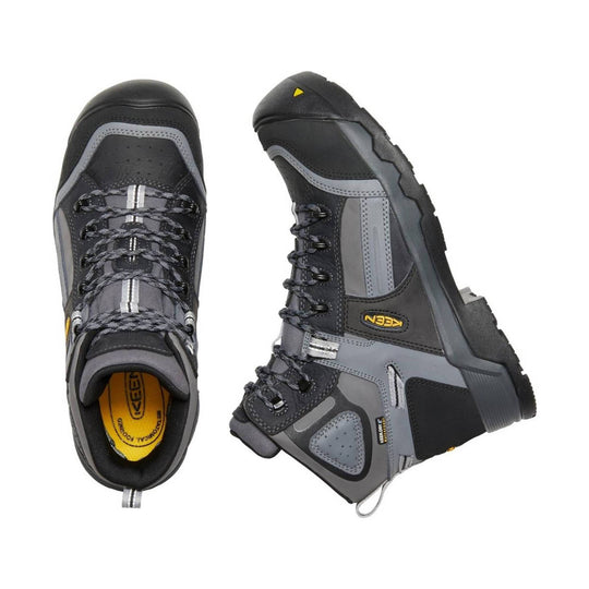 Gray and black insulated work boots shown from top and side views with black laces and yellow KEEN logo