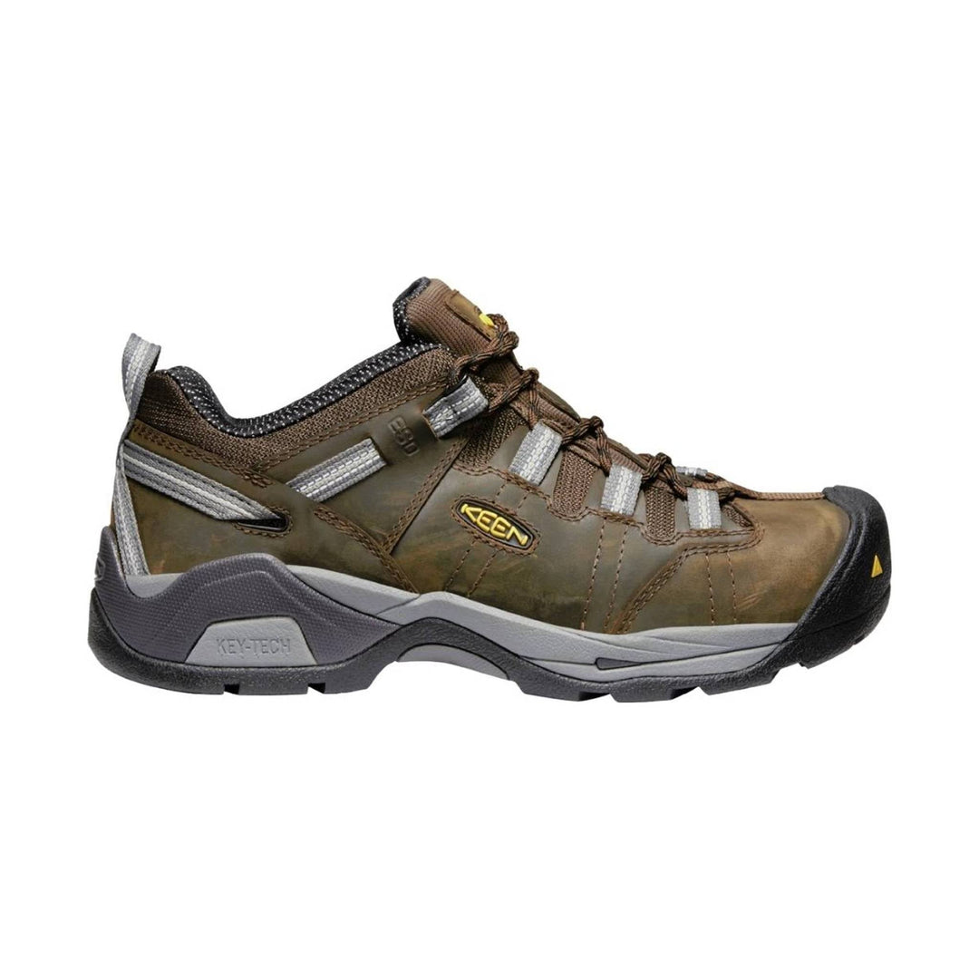 Brown low-cut work shoe with gray accents, bungee laces, and a black toe cap