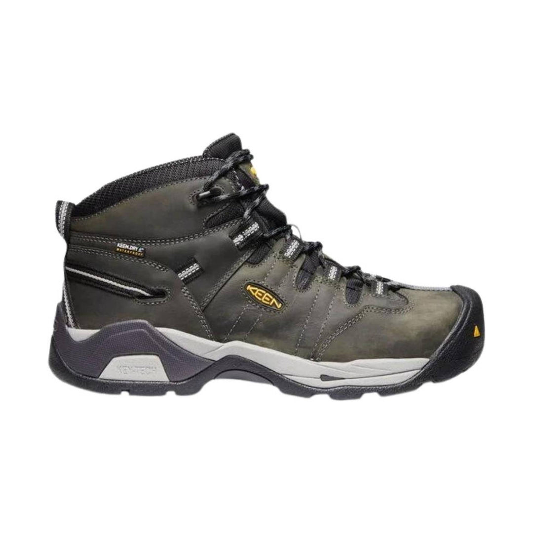Mid-height brown and black work boot with laces, a rubber toe cap, and a thick white midsole