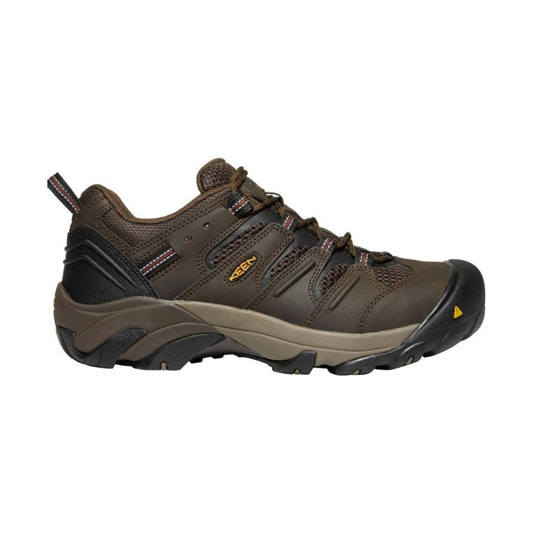Brown low-top work shoe with black sole and yellow toe accent, shown in side profile