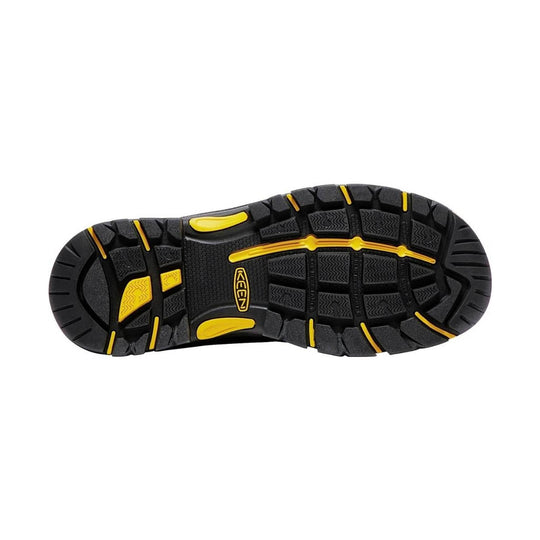 Black work boot outsole with yellow traction accents and KEEN logo