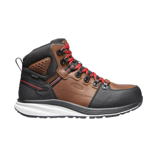 Brown and black mid-height hiking work boot with red laces and a thick white sole, side profile