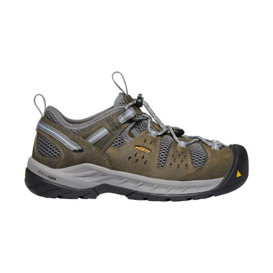 Olive and gray low-cut hiking shoe with bungee laces, mesh panels, and a black rubber toe cap