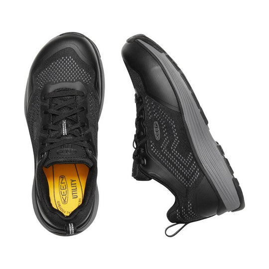 Black low-top work shoes with gray midsoles, mesh panels, and black laces, shown top and side view