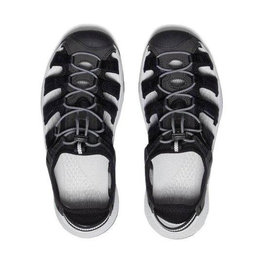 Black and gray closed-toe hiking sandals with bungee laces and side cutouts, shown from above