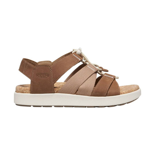 Brown and beige sandal with cork footbed, bungee laces, and white platform sole