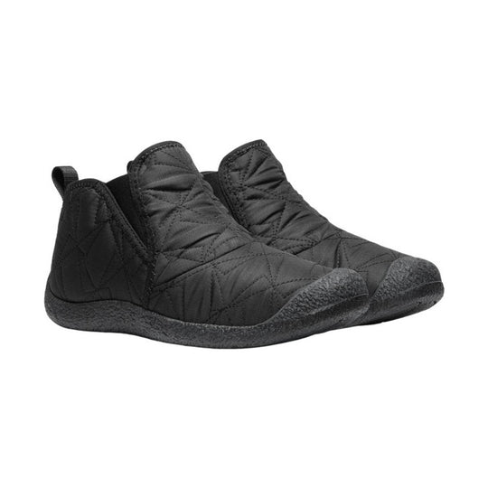 Black quilted ankle boots with textured rubber soles, shown in a side view