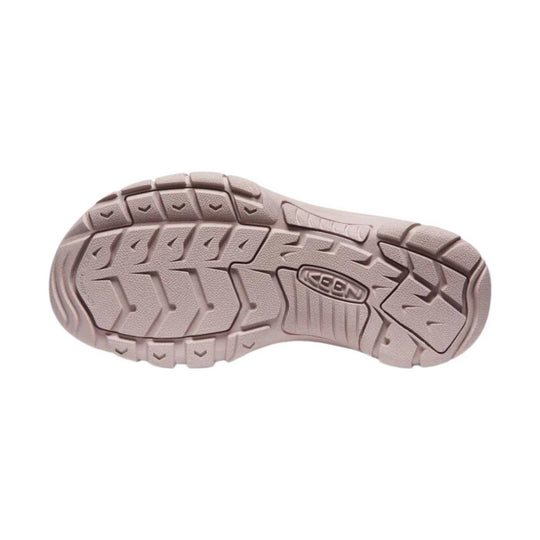 Pink-tan KEEN shoe outsole with deep tread and molded KEEN logo