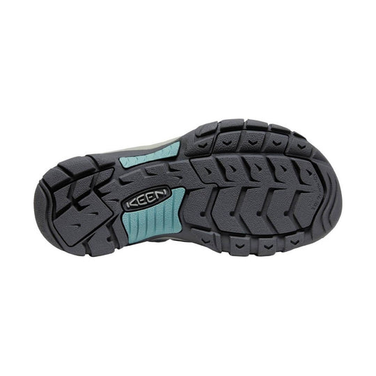 Black rugged outsole with teal accent panels and KEEN logo