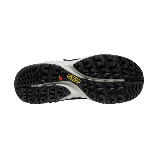 Black hiking boot outsole with deep lug tread, white midsole, and a yellow KEEN logo