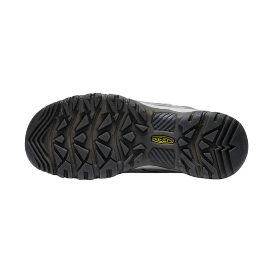 Black hiking shoe outsole with deep lug tread and a KEEN logo.