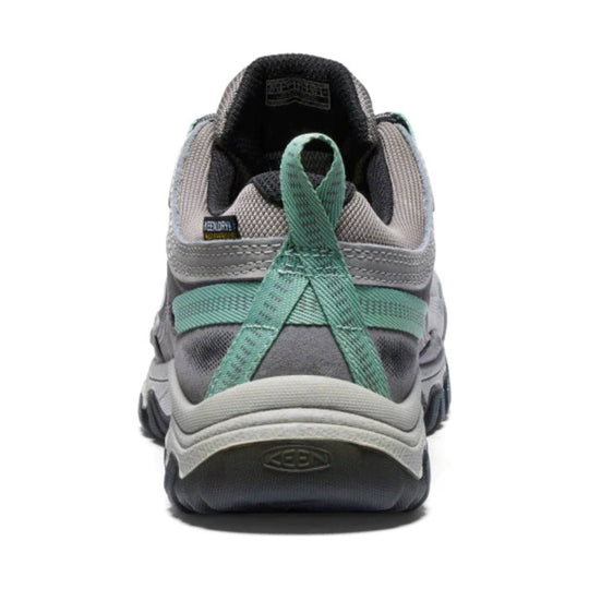 Gray hiking shoe seen from the back with teal laces, black collar, and a KEEN heel logo