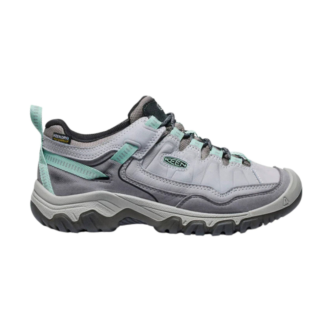Gray low-top hiking shoe with mint green accents and rugged black tread