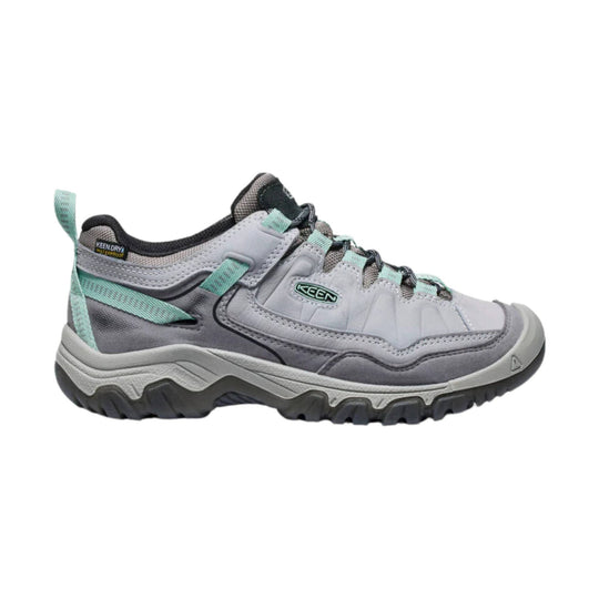 Gray low-top hiking shoe with mint green accents and rugged black tread