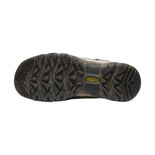 Dark hiking shoe outsole with deep traction lugs and a KEEN logo